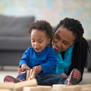 mom and child playing with blocks