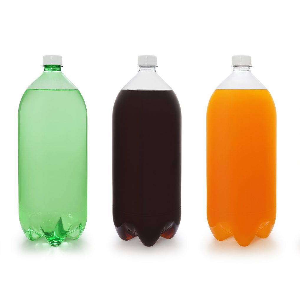 Various soda bottles flavors isolated on white