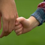 child holding hand