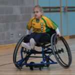 girl in wheelchair in gymnasium