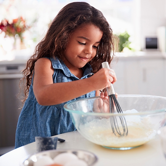 young girl cooking